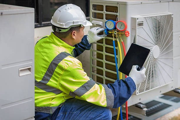 Professional Heat Pump Repair technician working in Manomet, MA